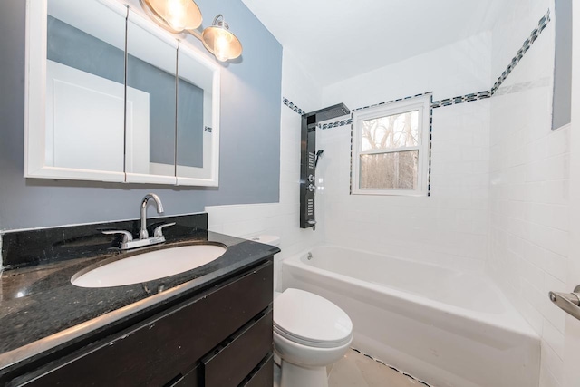 bathroom with toilet, bathtub / shower combination, and vanity