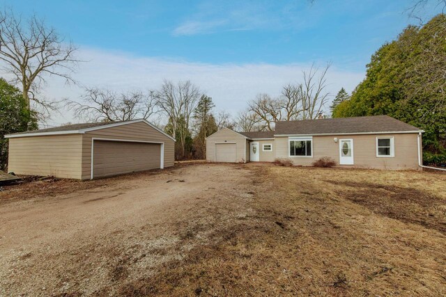 view of front of home featuring an outbuilding and a garage