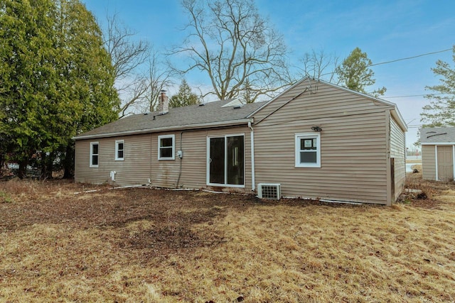 rear view of property with a chimney