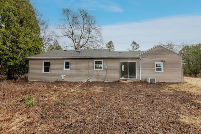 back of house featuring central AC unit