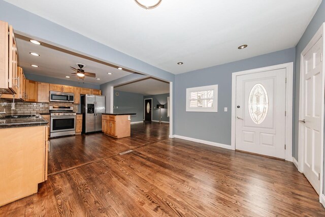 foyer entrance with recessed lighting, baseboards, a ceiling fan, and dark wood-style flooring