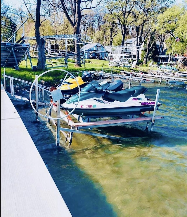 view of dock featuring a water view and boat lift