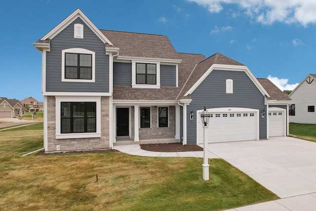 view of front facade featuring driveway, roof with shingles, a front lawn, a garage, and stone siding