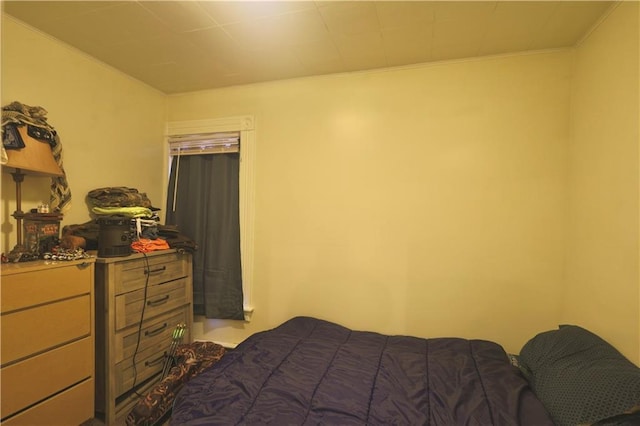 bedroom with ornamental molding