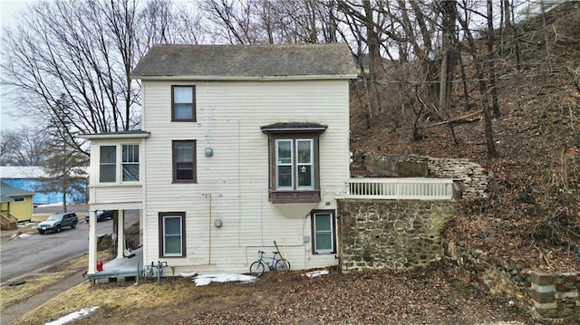 view of front of house with a shingled roof