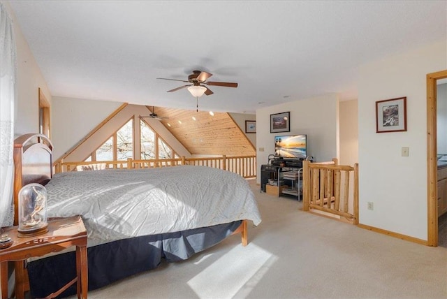 bedroom with baseboards, lofted ceiling, and carpet flooring