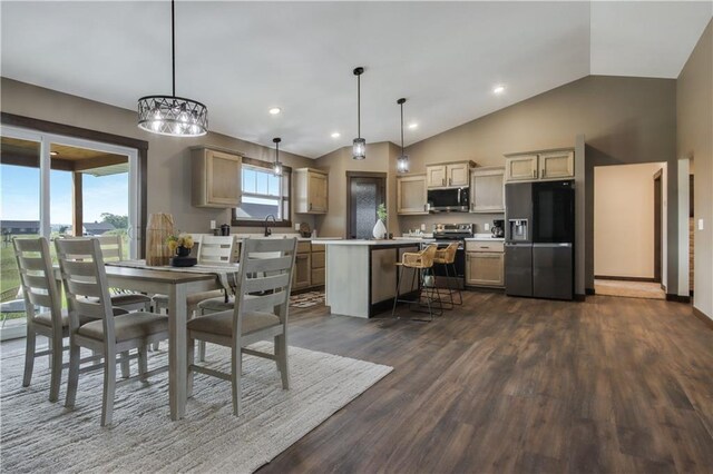3557 114th St, Chippewa Falls, WI 54729 - dining area featuring recessed lighting, vaulted ceiling, dark wood-style flooring, and an inviting chandelier