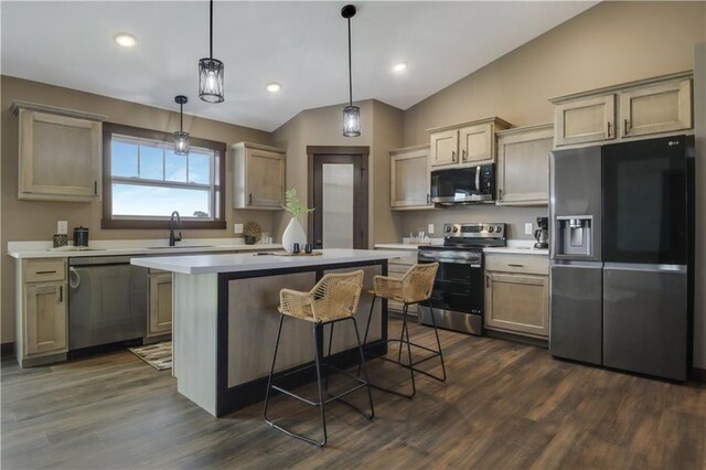 3557 114th St, Chippewa Falls, WI 54729 - kitchen featuring lofted ceiling, light countertops, a sink, a kitchen island, and appliances with stainless steel finishes