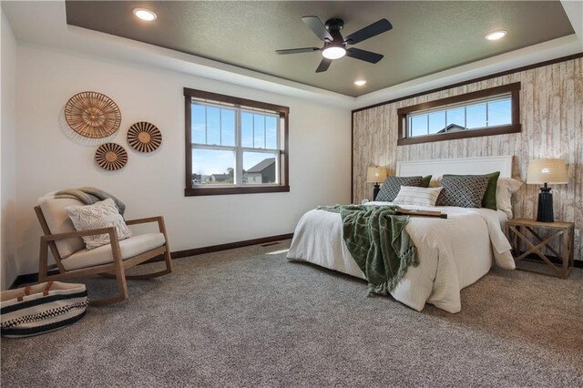 3557 114th St, Chippewa Falls, WI 54729 - carpeted bedroom with baseboards, recessed lighting, a raised ceiling, and multiple windows