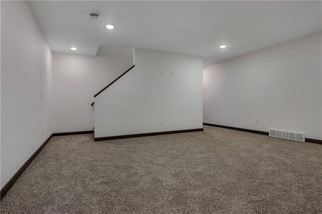 3557 114th St, Chippewa Falls, WI 54729 - finished basement with baseboards, visible vents, carpet, and recessed lighting