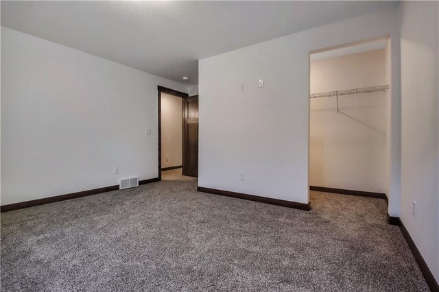 3557 114th St, Chippewa Falls, WI 54729 - unfurnished bedroom featuring baseboards, carpet flooring, and visible vents
