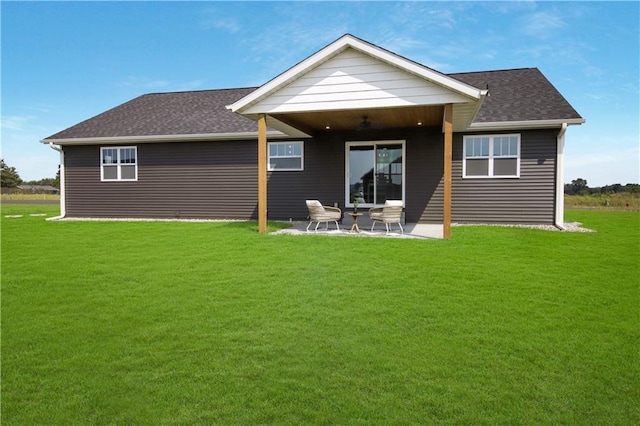 3557 114th St, Chippewa Falls, WI 54729 - back of property with a patio area, a lawn, and a ceiling fan