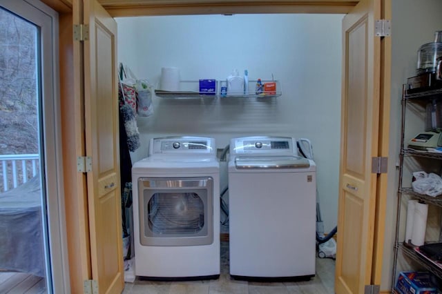 washroom featuring washer and dryer and laundry area