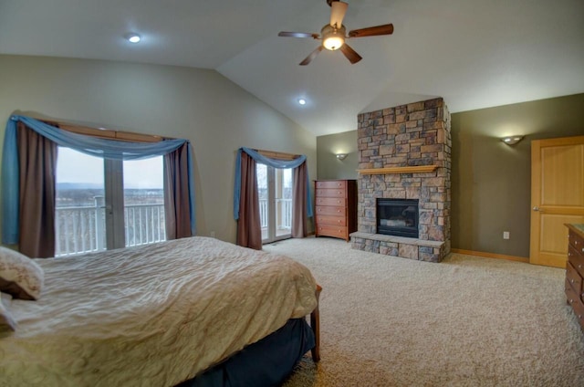 bedroom with a ceiling fan, a fireplace, vaulted ceiling, access to outside, and carpet flooring