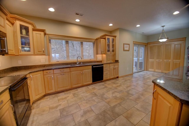 kitchen featuring visible vents, recessed lighting, a sink, black appliances, and glass insert cabinets