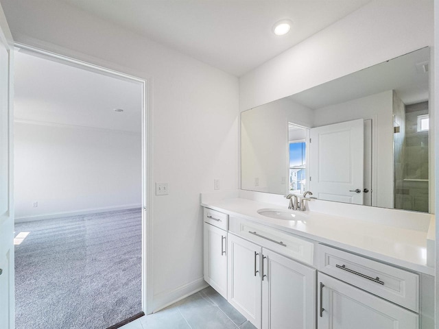 bathroom featuring vanity and baseboards