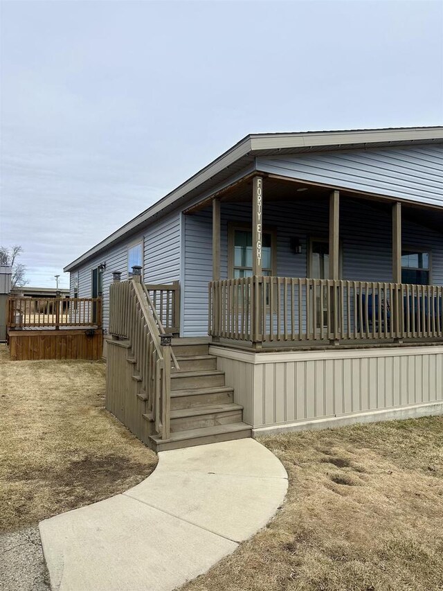 view of exterior entry with a porch