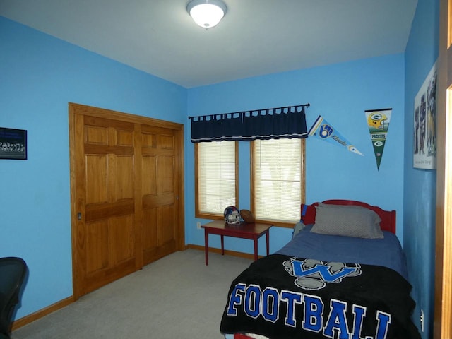 carpeted bedroom with baseboards