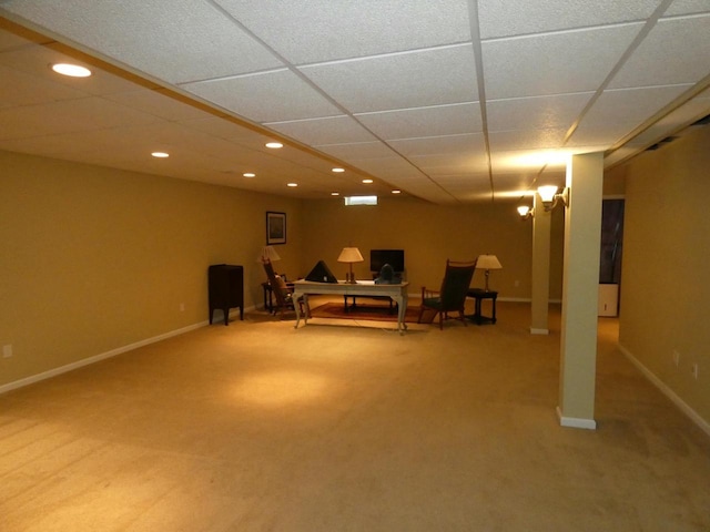 unfurnished room featuring carpet, recessed lighting, baseboards, and a paneled ceiling