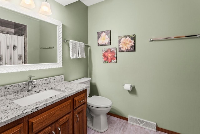 bathroom featuring vanity, baseboards, visible vents, curtained shower, and toilet