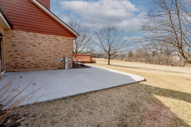 exterior space featuring a deck and a patio