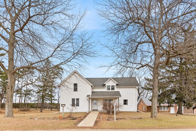 N402 24th Ave, Neshkoro, WI 54960 - traditional-style house featuring a front yard and a shingled roof