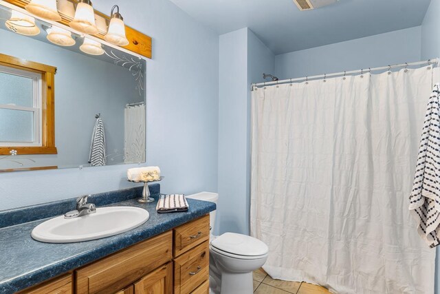 N402 24th Ave, Neshkoro, WI 54960 - full bathroom featuring a shower with curtain, toilet, tile patterned flooring, and vanity