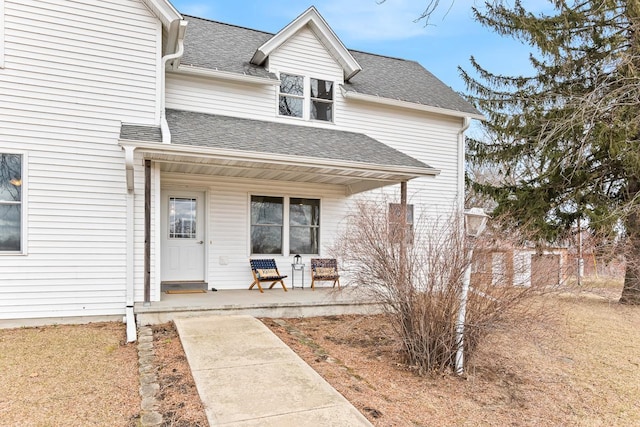 N402 24th Ave, Neshkoro, WI 54960 - view of front facade with a shingled roof and a porch