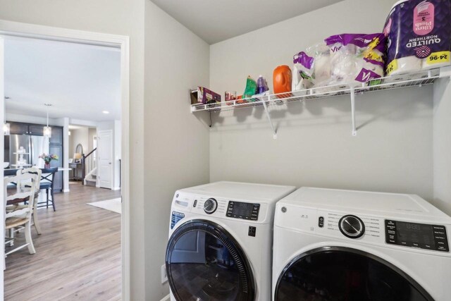 6109 Misty Bridge Rd, Madison, WI 53718 - laundry area featuring laundry area, washing machine and dryer, and light wood-type flooring