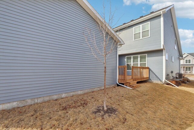 6109 Misty Bridge Rd, Madison, WI 53718 - back of property featuring a lawn and a deck