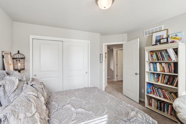 6109 Misty Bridge Rd, Madison, WI 53718 - bedroom with carpet, visible vents, and a closet