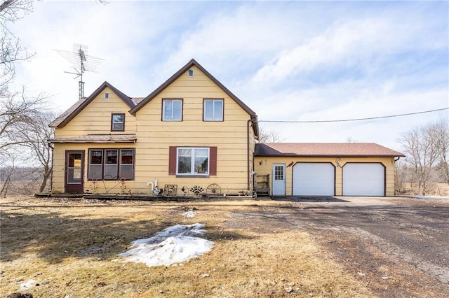 view of front of house featuring an attached garage and driveway