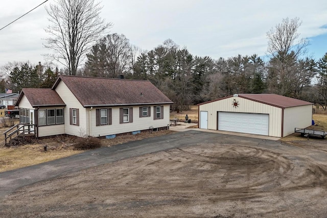 523 State Highway 73, Nekoosa, WI 54457 - view of front of property with a detached garage, an outdoor structure, and a shingled roof
