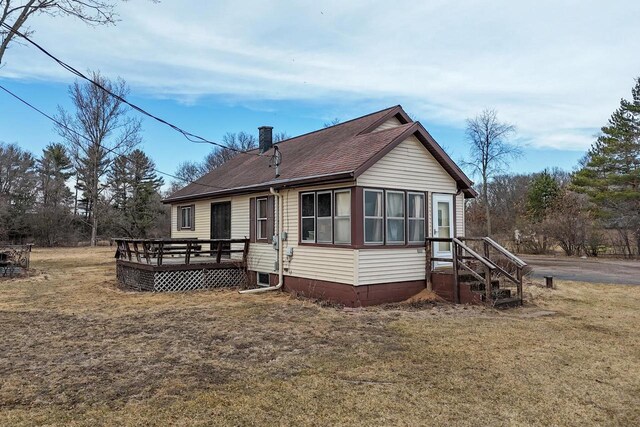 523 State Highway 73, Nekoosa, WI 54457 - back of property featuring a deck, a yard, and a shingled roof
