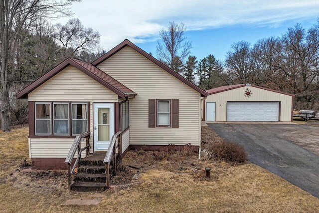 523 State Highway 73, Nekoosa, WI 54457 - bungalow-style home featuring an outbuilding and a detached garage