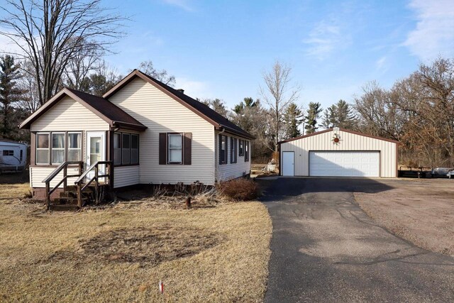 523 State Highway 73, Nekoosa, WI 54457 - view of front of home featuring a detached garage and an outdoor structure