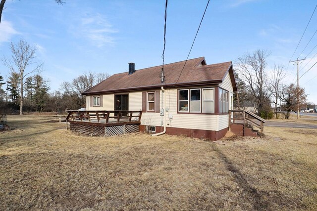 523 State Highway 73, Nekoosa, WI 54457 - back of property with a yard, a wooden deck, and a chimney
