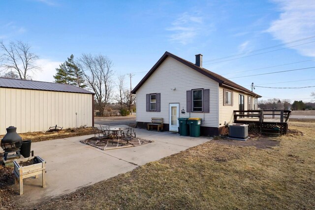 523 State Highway 73, Nekoosa, WI 54457 - back of property with central AC unit and a patio area