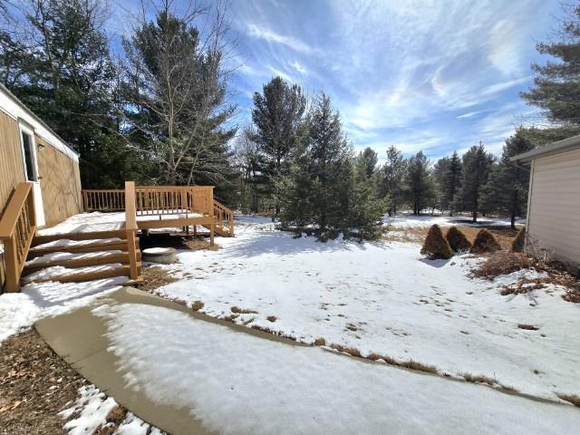 W5029 N Pathfinder Cir, Shawano, WI 54166 - yard layered in snow with a wooden deck