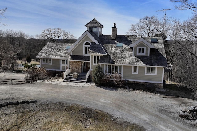2842 Moelter Dr, Lake Geneva, WI 53147 - view of front facade featuring driveway and a chimney