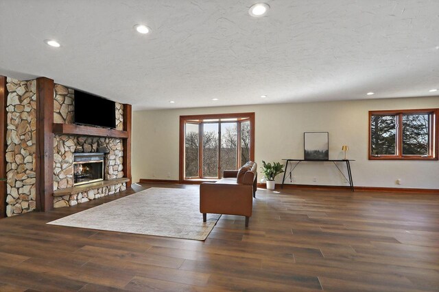 2842 Moelter Dr, Lake Geneva, WI 53147 - living room featuring wood finished floors, baseboards, a fireplace, recessed lighting, and a textured ceiling