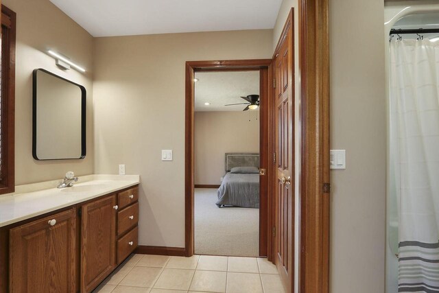 2842 Moelter Dr, Lake Geneva, WI 53147 - ensuite bathroom featuring vanity, a ceiling fan, baseboards, tile patterned flooring, and connected bathroom