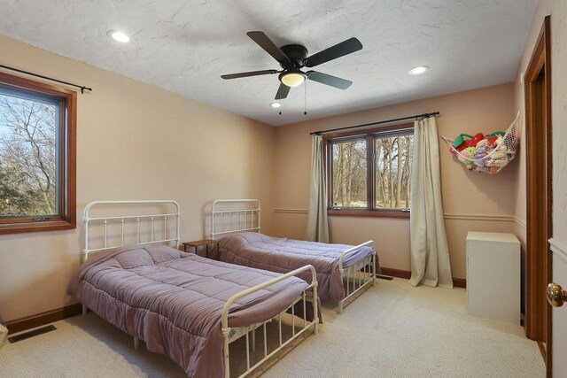 2842 Moelter Dr, Lake Geneva, WI 53147 - bedroom featuring visible vents, light colored carpet, a textured ceiling, and baseboards
