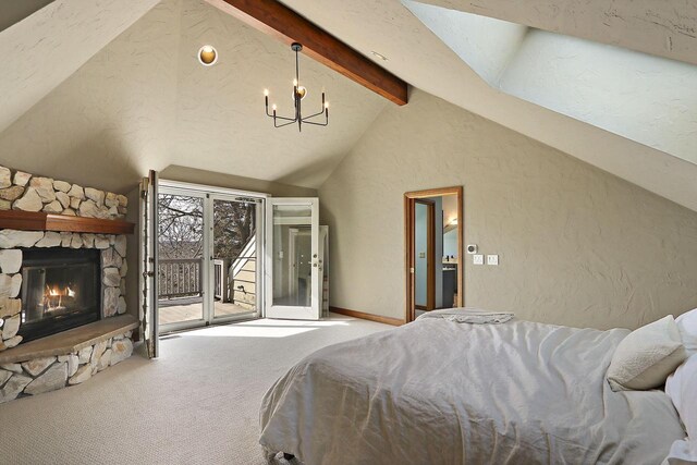 2842 Moelter Dr, Lake Geneva, WI 53147 - carpeted bedroom featuring beam ceiling, a stone fireplace, access to exterior, a textured wall, and a chandelier
