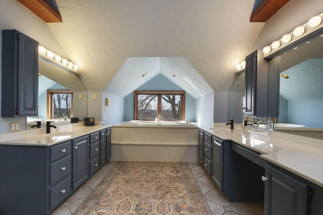2842 Moelter Dr, Lake Geneva, WI 53147 - bathroom with lofted ceiling, a textured ceiling, and a bath
