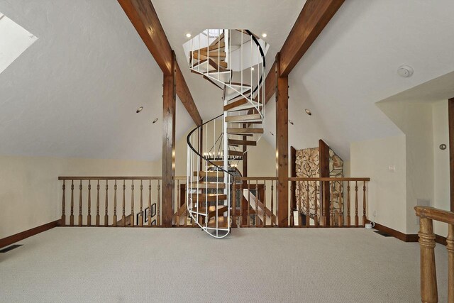 2842 Moelter Dr, Lake Geneva, WI 53147 - interior space featuring visible vents, carpet, lofted ceiling with beams, and baseboards
