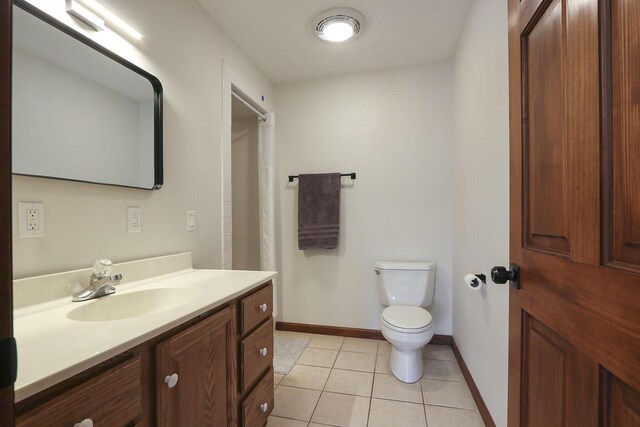2842 Moelter Dr, Lake Geneva, WI 53147 - bathroom featuring curtained shower, baseboards, toilet, tile patterned floors, and vanity