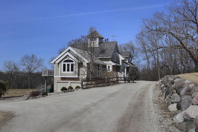 2842 Moelter Dr, Lake Geneva, WI 53147 - exterior space with stairs, a garage, and dirt driveway