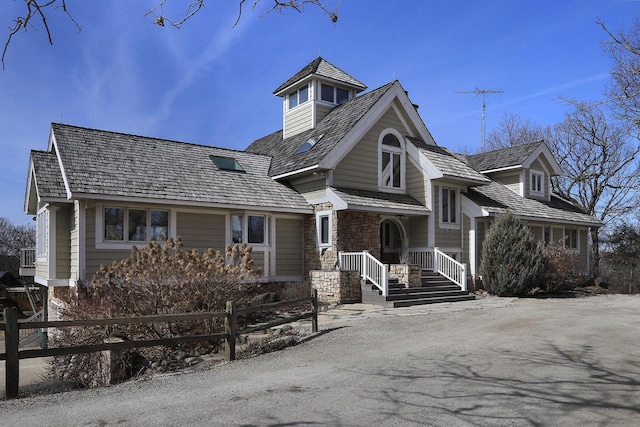 2842 Moelter Dr, Lake Geneva, WI 53147 - view of front of house featuring fence and stone siding