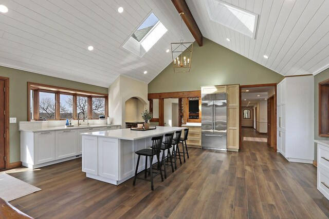 2842 Moelter Dr, Lake Geneva, WI 53147 - kitchen with a sink, built in fridge, a center island, an inviting chandelier, and a skylight